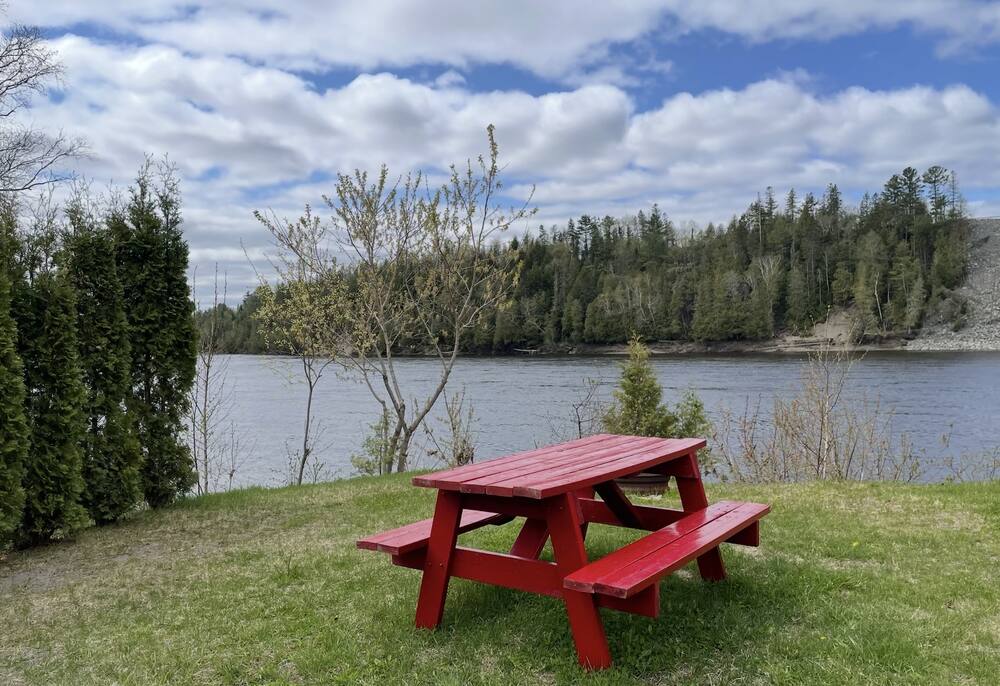 Red picnic table overlooking the St. John River at Eagle Falls
